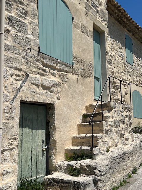 Sage-green door and stone steps, Villeneuve