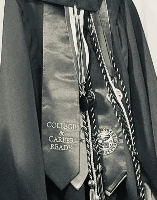 Graduation gown with stoles and cords