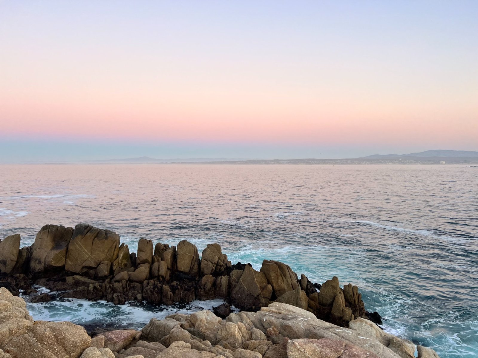 Pastel dusk over the sea at Pacific Grove