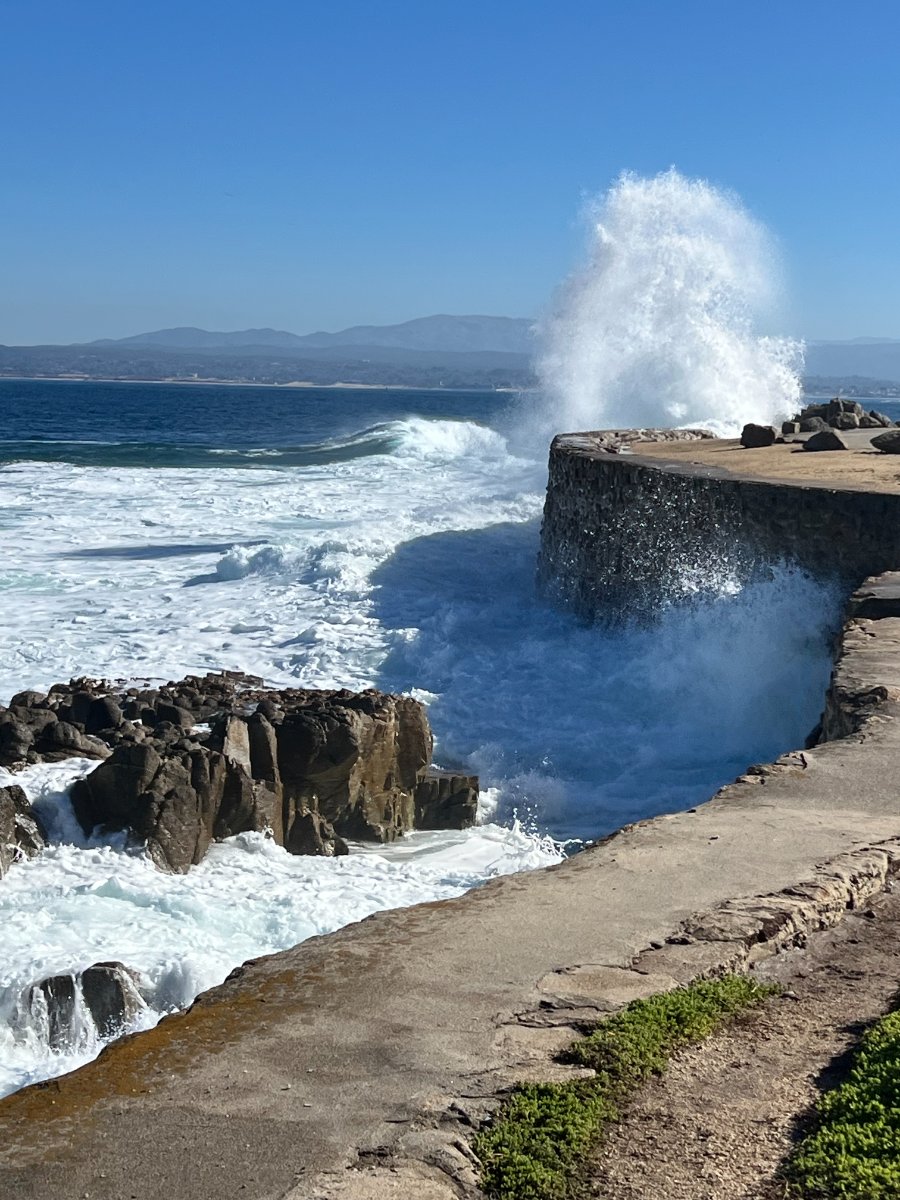 Surf exploding against the sea wall, Monterey